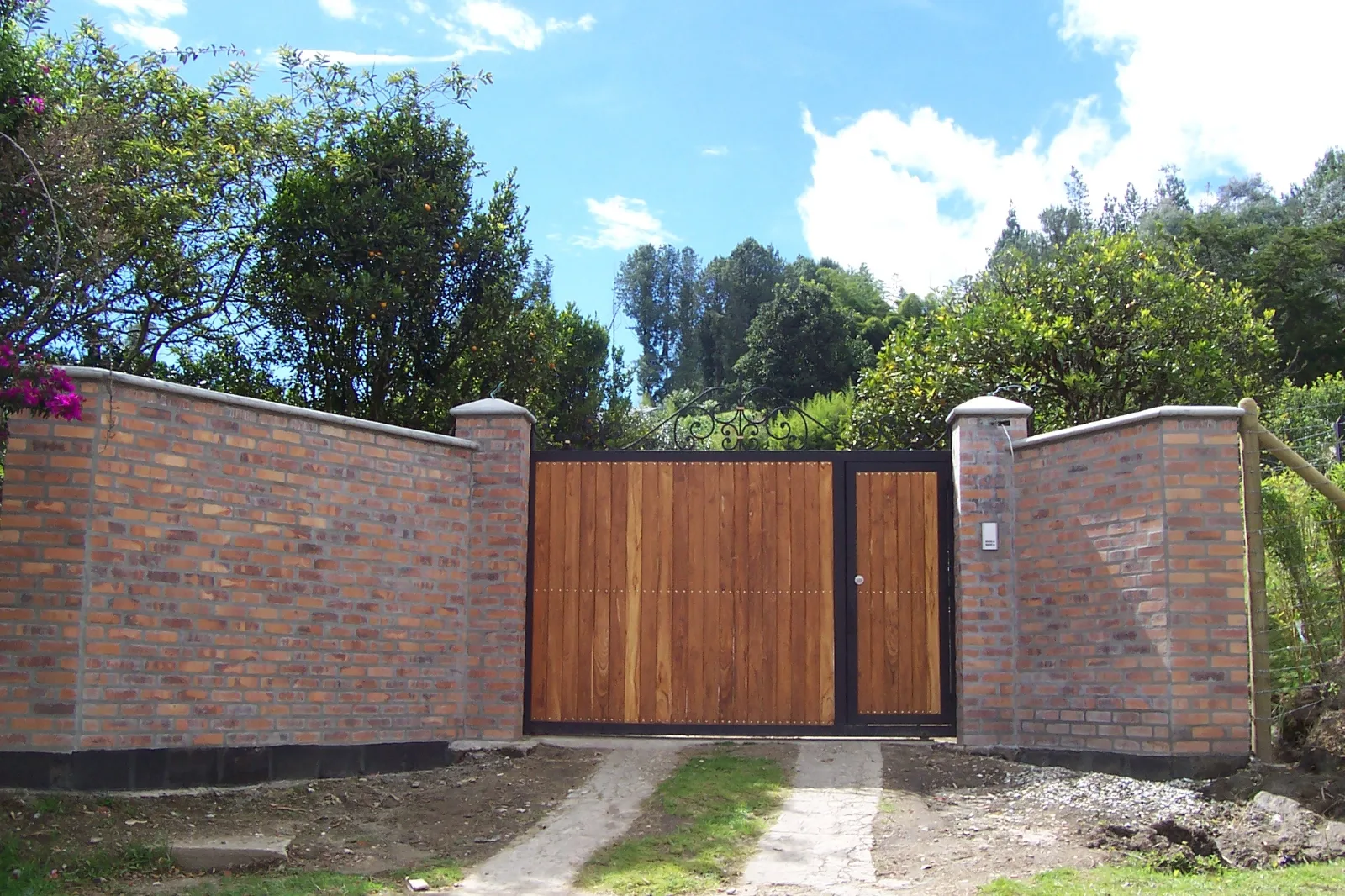 Brick wall with a cedar gate