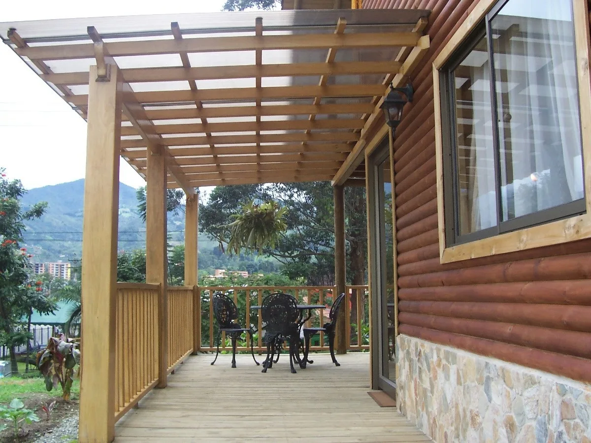Cabin deck with a pergola overlooking the hills