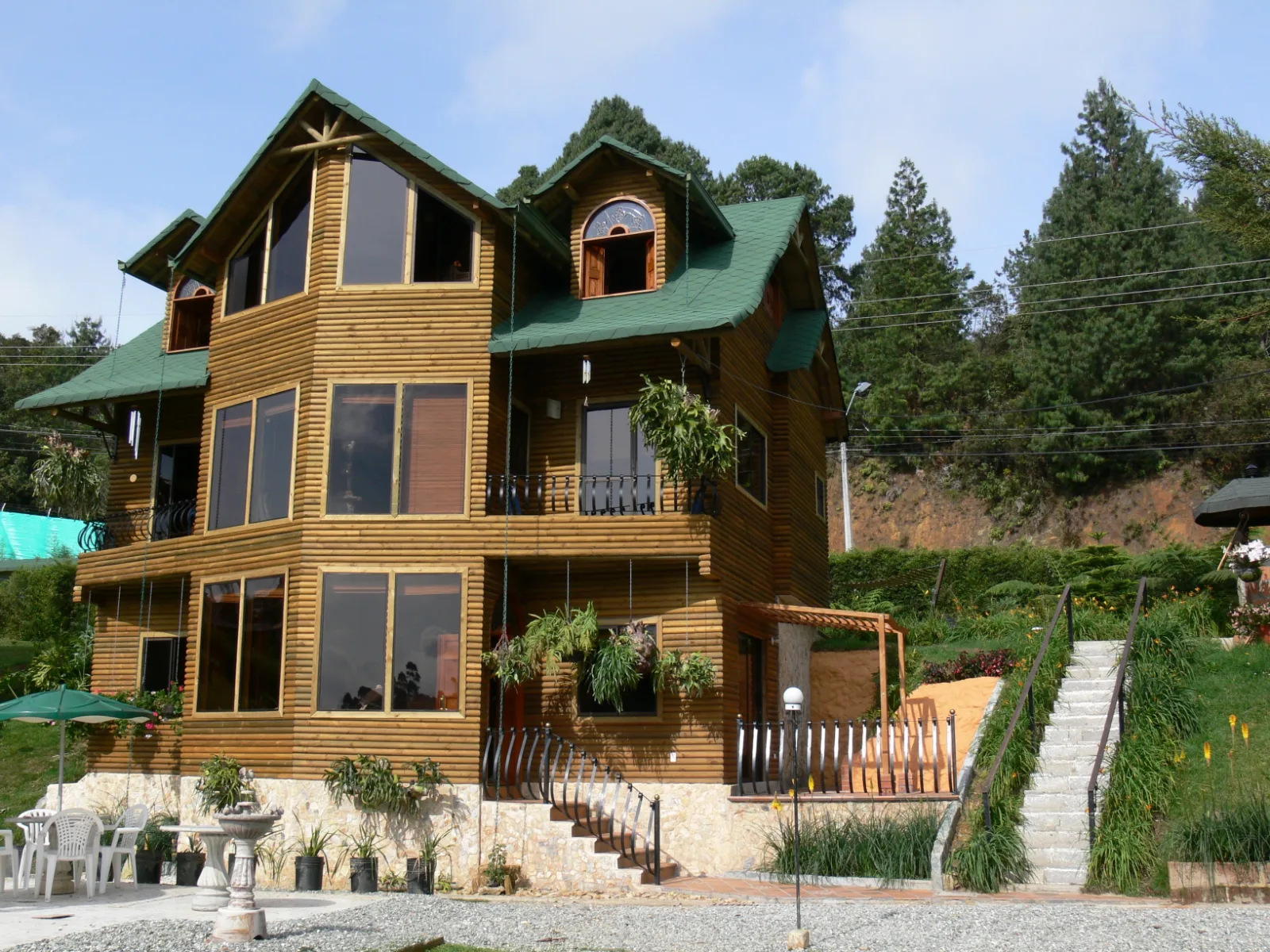 Three-storey timber home with a green roof
