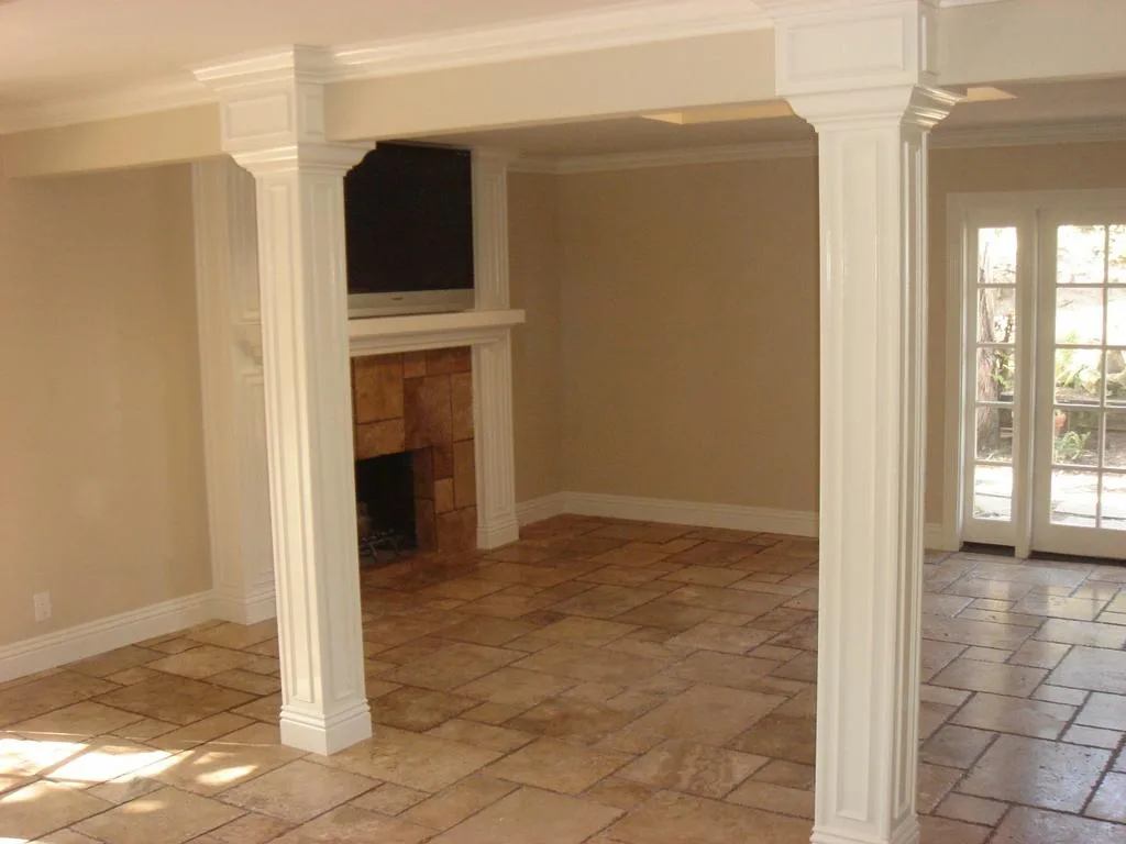 Fireplace surround with columns and travertine floor
