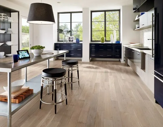 Modern kitchen with island seating and light oak floor