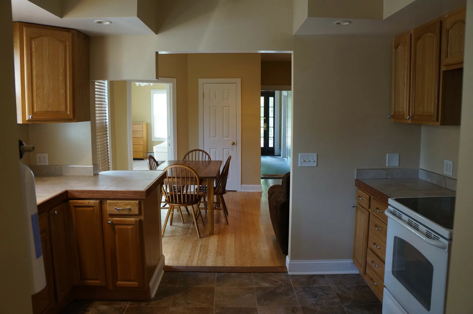 Oak kitchen with ceramic tile floor