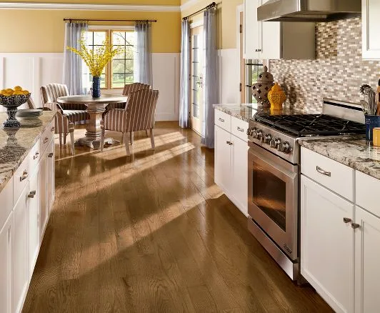 White kitchen with a stone backsplash and gas range