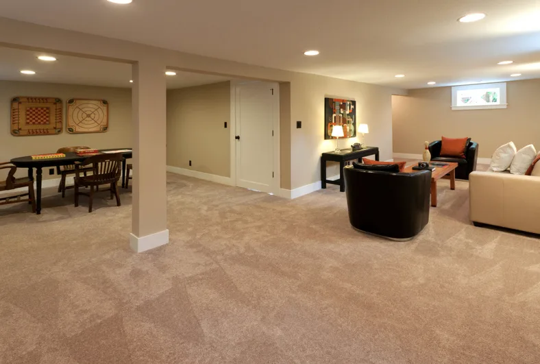 Finished basement with carpet and pot lights
