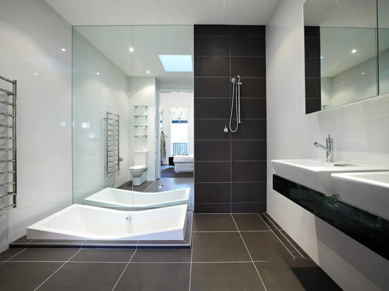 Walk-in shower with dark porcelain tile