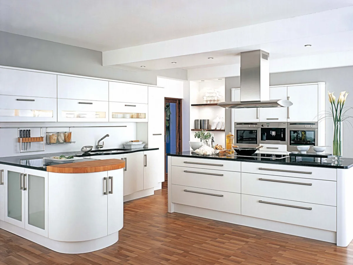 White modern kitchen with island and hardwood floor